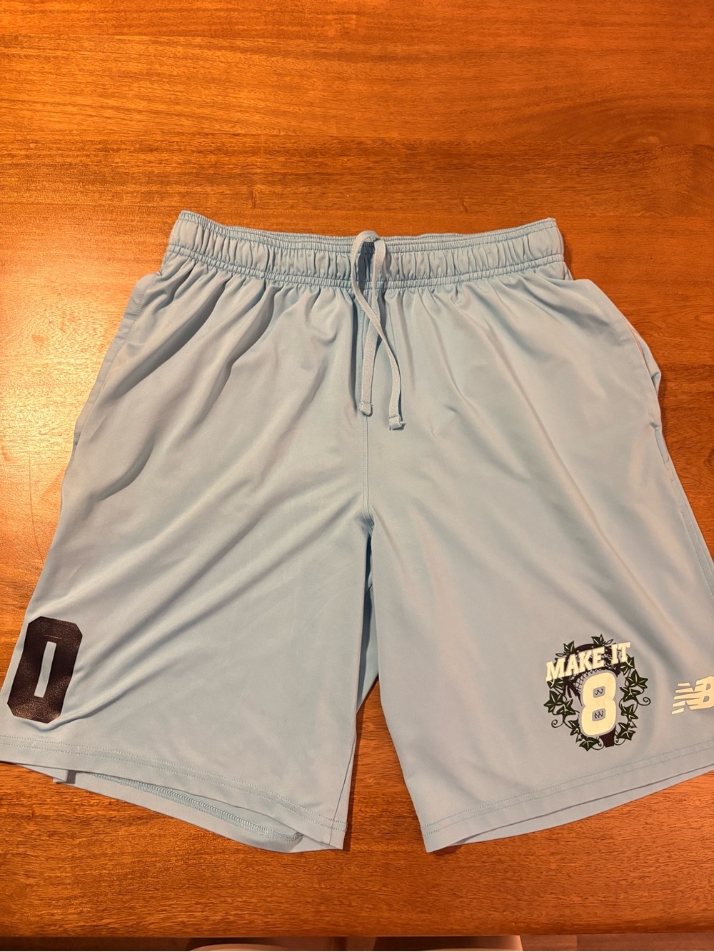 New Balance Men’s Light Blue Athletic Shorts with 'Make It 8' Graphic